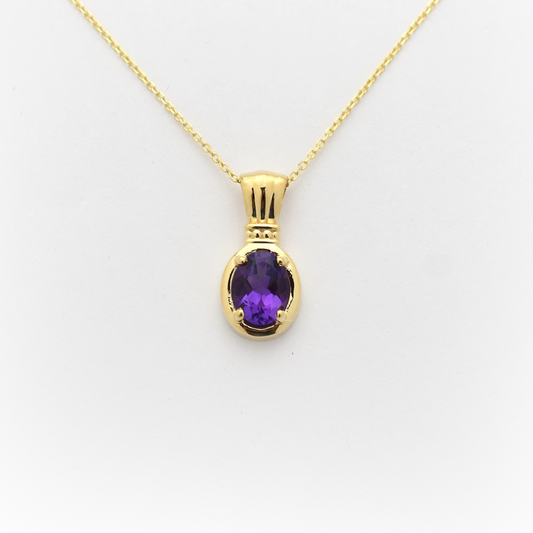 A 14k gold oval amethyst necklace with a lobster lock on a white background.