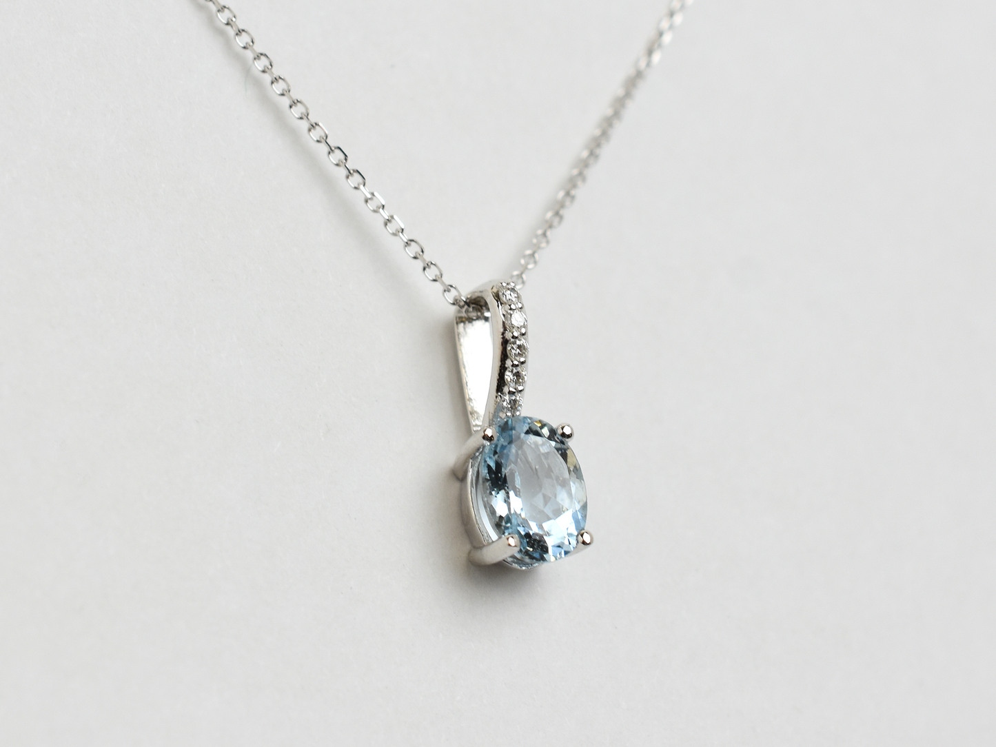 14k gold Oval aquamarine and diamond pendant