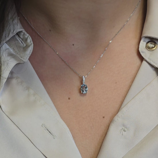 14k gold Oval aquamarine and diamond pendant