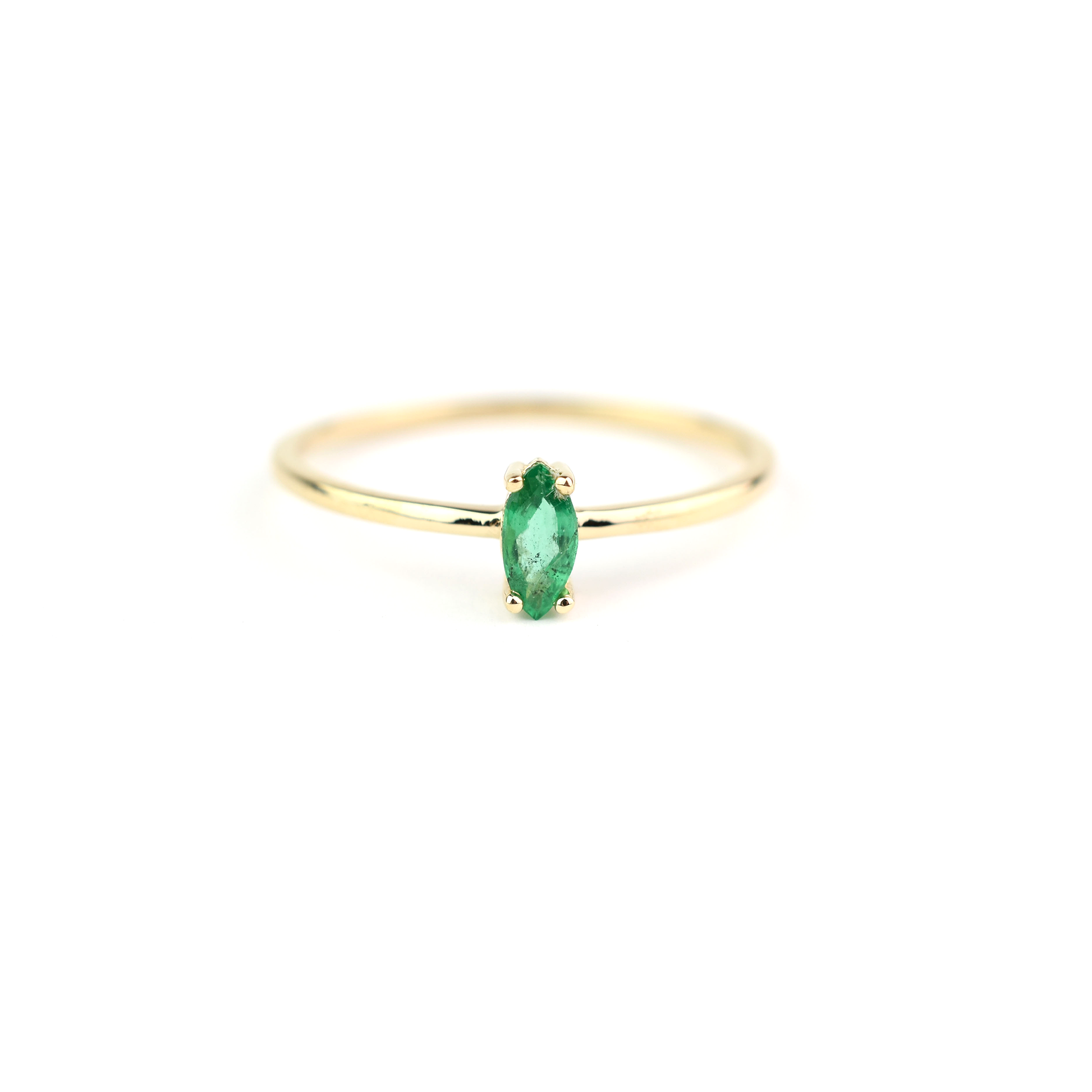 14k gold marquise shaped natural emerald set in a 4 prong setting 